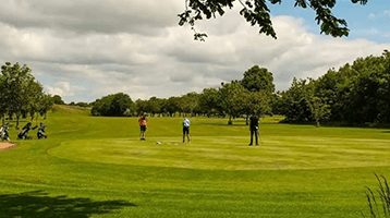 view of golfers playing on golf course